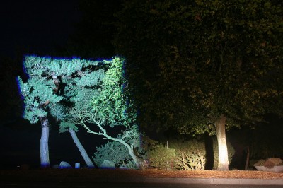Here we see the distinctive blue-outlined rectangle defined by the beam of the Bushnell Rubicon T300L HD flashlight, as compared with the beam of a car headlight.