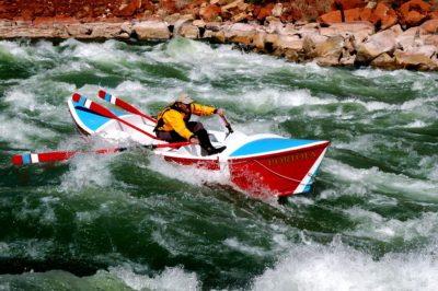 Greg Hatten races his PORTOLA down the tongue, hitting his line in Soap Rapid. Eleven miles below launch, this second major rapid has a 17' drop and gave the rowers a feel for the river and their newly built boats.