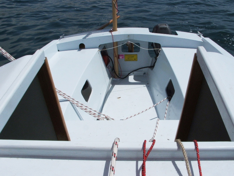 The offset mizzen and the outboard flank Sweet Pea's rudder. The sides of the footwell are angled provide comfortable footing when the boat heels while under sail.