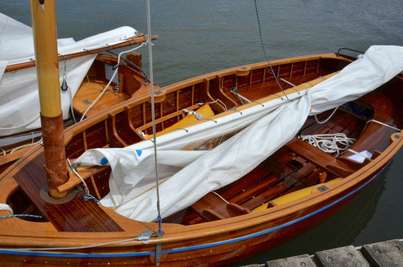 While the 12' dinghies are built for racing under sail, they outfitted with oarlocks and rowing thwarts to fulfill the class requirement that “each boat shall be built, equipped and finished complete in every respect and so as to be fit for use as a useful yacht's centerboard dinghy.”