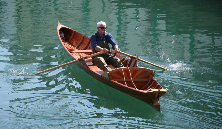 The Thames waterman's stroke, the traditional form of rowing a skiff of this type, is described in the Sept/Oct issue of WoodenBoat.