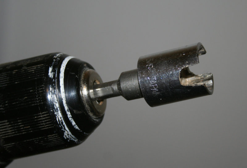 A 5/8" socket with grooves cut in it will fit over most clamp screws and engage the handle.