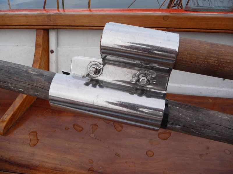 The Scullmatix is made of 1/8" stainless steel plate and secured withe a pair of stainless 5/16" bolts and wingnuts. Resting in the boat here, it's shown upside down.