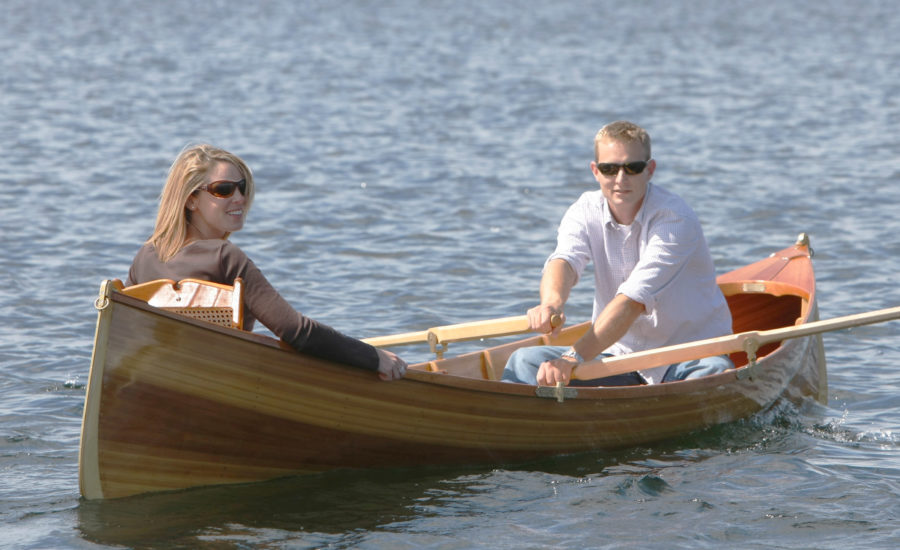 Guideboat builder Justin Martin takes Erin, his bride to be, out or summer row. She has her backrest up for comfort; Justin has his down for rowing.