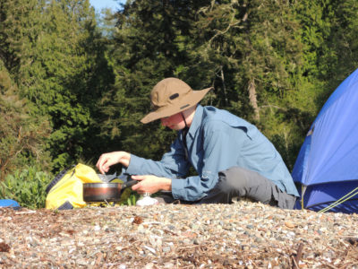 At home, Merry's no fan of cooking; but in camp and near the water, he's happy to oblige. Isobutane canister stoves nicely balance convenience and safety on shorter trips.