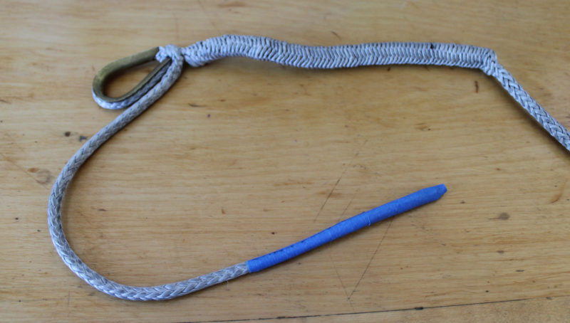 After the fid is removed, the braid remains loose. A bit of tape around the end of the line stiffens it enough to slip through the loosened braid.