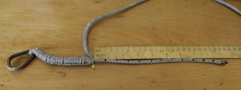 With a straight pin holding back the loosened braid, the tail is marked in 12 equal increments.
