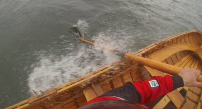 Lowering the centerboard and "tacking" can make rowing to weather easier than fighting the wind head on.