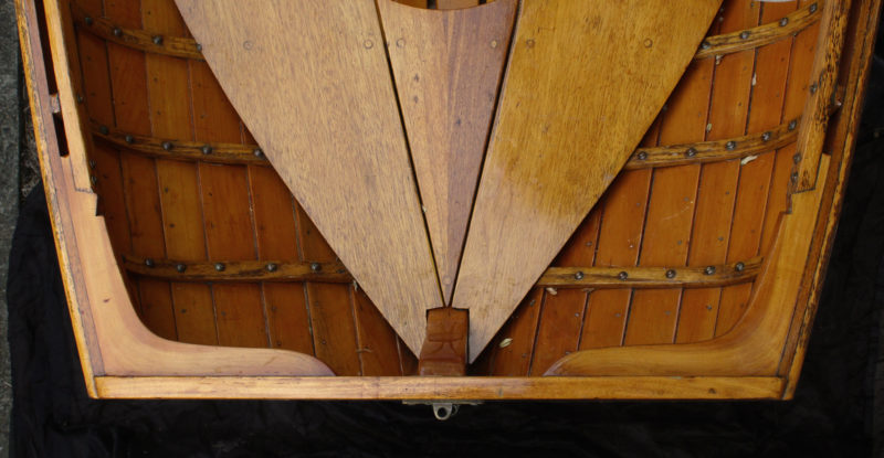 The grain in these bookmatched fruitwood quarter knees not only follows the angle between the transom and the sheerstrake, it curves into the transom at the ends of the toes.