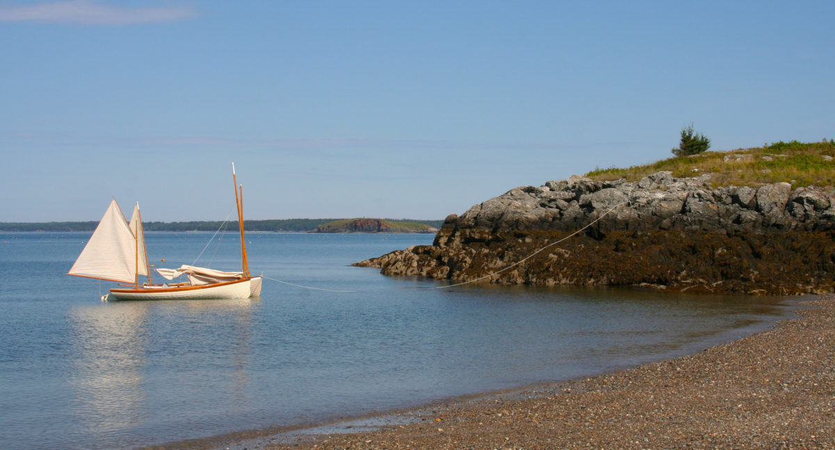 At Nubble Beach on Maine’s Butter Island, the tide exposes several hundred feet of beach at low ebb. Here, the anchor was set just beyond the low tide mark, and the extra warp was walked out the rocky promontory to secure the boats. With this adaptation of the Pythagorean system, the boats can be pulled into water even deeper than it is where the anchor is set.