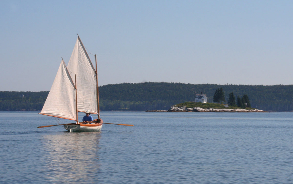 In a light breeze Rob row-sailed toward Pumpkin Island and the top of the Eggemogin Reach. Sail-assisted rowing made it possible to cover mileage more effectively when sail alone would have been too slow to keep the pair on schedule to make good use of the tidal currents around Penobscot Bay.