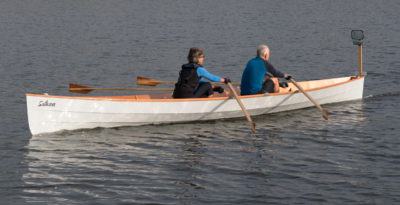 The post at the stern supports two mirrors; the larger one at top provides a good view forward, and the wide-angle mirror below it takes in a broader view. Mirrors are common fixtures on rowing boats used in races in Finland.