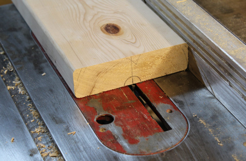 Each of the inner sections of 2x6 needs a semi-circular groove to to accommodate the axle. A tablesaw starts the job.