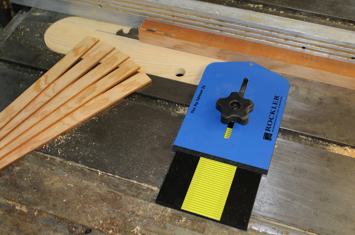 The ball-bearing equipped jig, along with a shop-made zero-clearance table-saw insert, makes ripping strips for laminations safer than sawing thin stock the on the fence side of the blade.