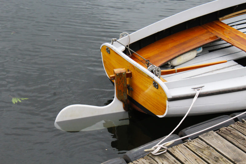 Unlike cat-boat rudders, where the tiller runs horizontally along the top of the blade, A spritsail-boat tiller are slipped into mortise in a rudder head.