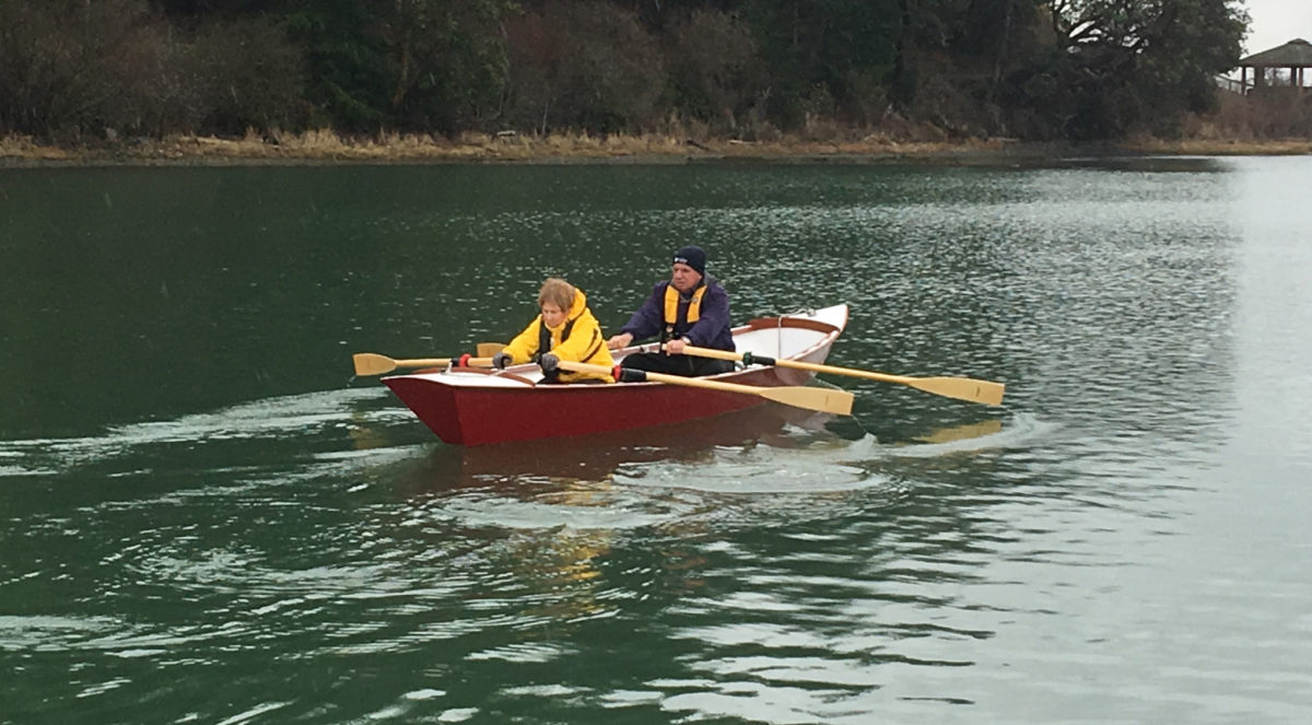 SCARLETT is a Fairhaven Flyer built for tandem rowing with fixed thwarts and gunwale-mounted oarlocks.