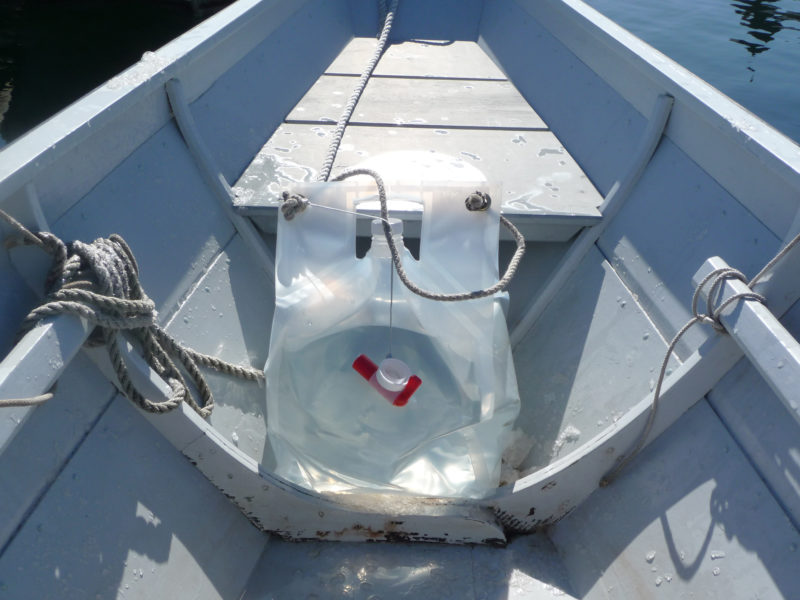 Five gallons of water provide 40 lbs of ballast in the stern of the author's Swampscott dory.