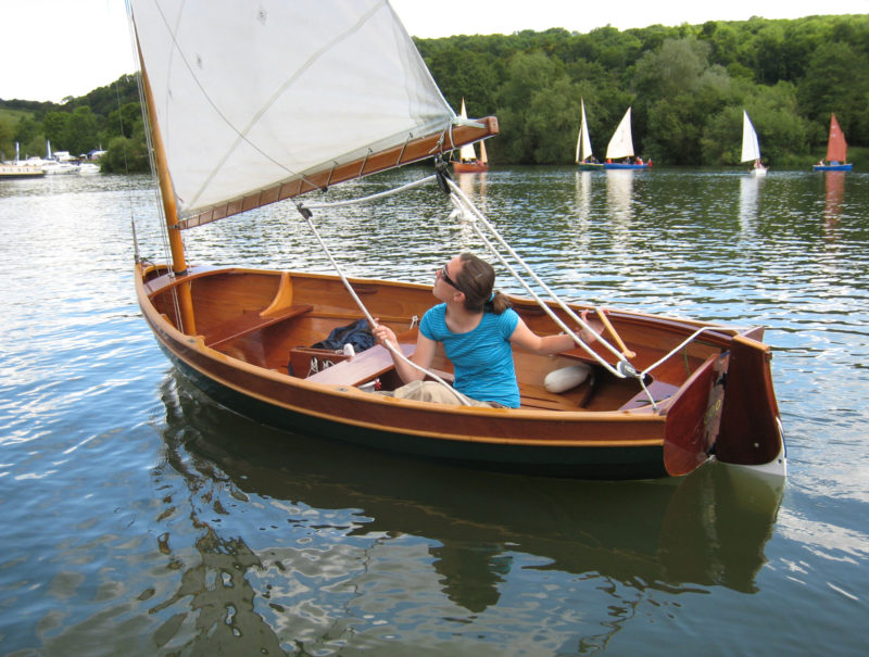 The floorboards provide comfortable, dry seating while sailing in light air.