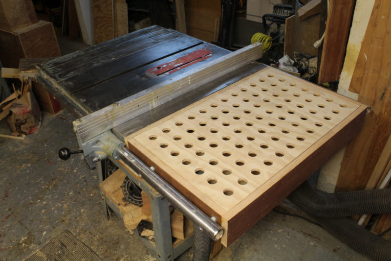 A simple downdraft table can put the space between the rip-fence rails to good use.