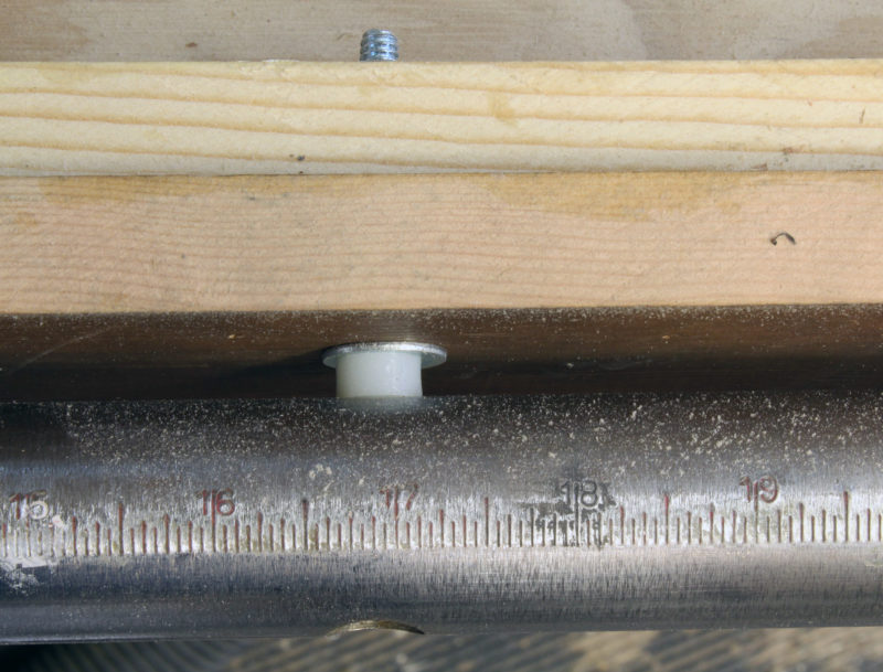 The downdraft table must provide clearance for the rip fence. A washer and a 1/4" nylon-sleeve spacer work for this tablesaw.