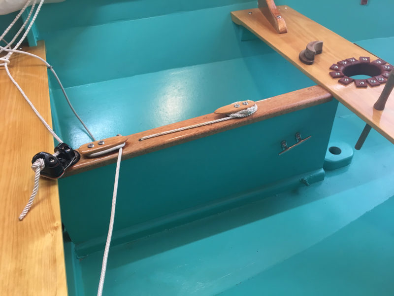 The plans don't call for floorboards, but they're easily added to separate the occupants from water int he bilge. Note the elongated hole for the mast and crescent shaped plug on the thwart. The plug goes forward of the mast when the jib is used, aft for sailing with the main alone.