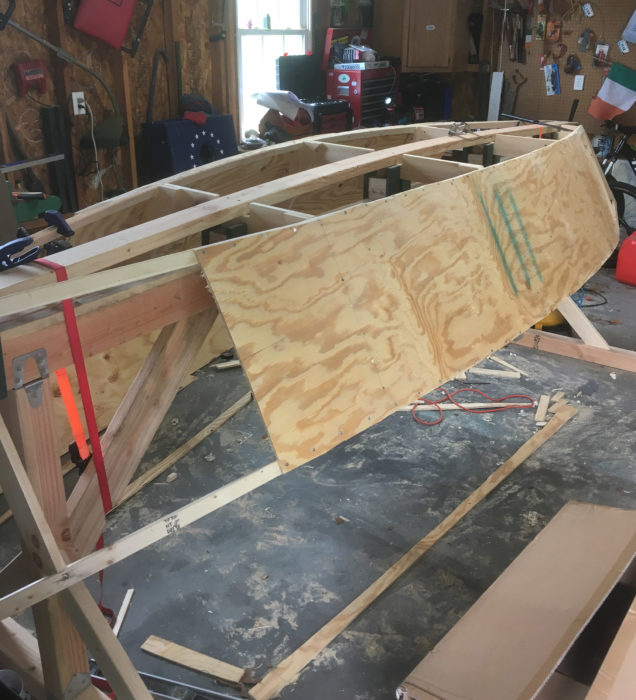 The plywood panels take their shapes from the chine logs and inwales. The butt joints will be backed with plywood plates.