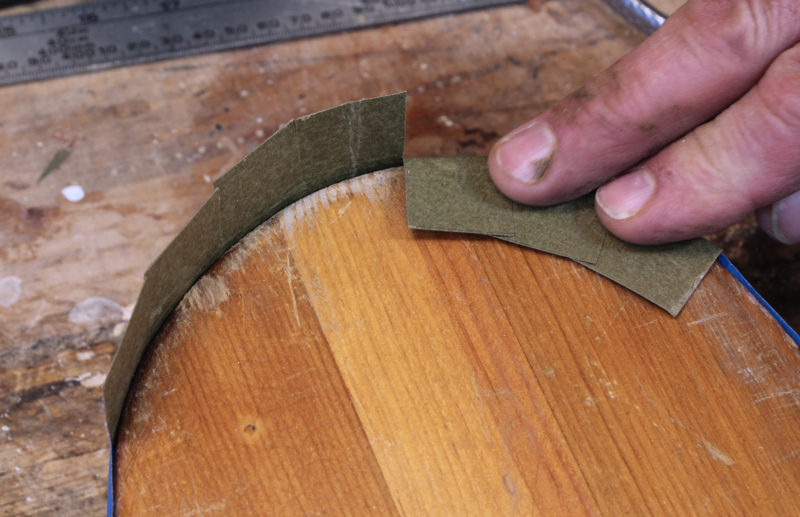 The flaps will overlap and where they intersect at the inside edge where the angled cut should be made to achieve the correct taper for each flap.