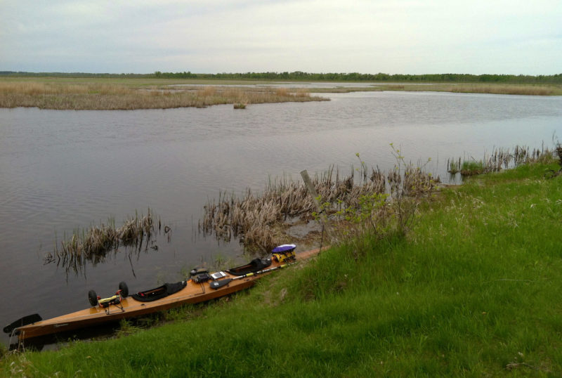 At its headwaters, the narrow stream of the Mississippi twists and turns in through a maze of wetlands and bogs. Checking the current's effect on underwater plants helped Barb and Gene stay with the main channel, avoiding costly wrong turns.