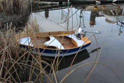 The motor cocks up by simply pulling on the tiller. A push drops the prop back into the water. The EP Carry was a good match for the 7' 9" Eastport Pram.