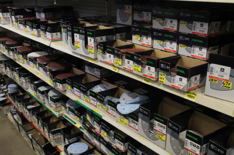 One side of one aisle has sanding discs that you can buy individually or by the box. There are a lot of products that you can buy without the plastic packaging that is common elsewhere.