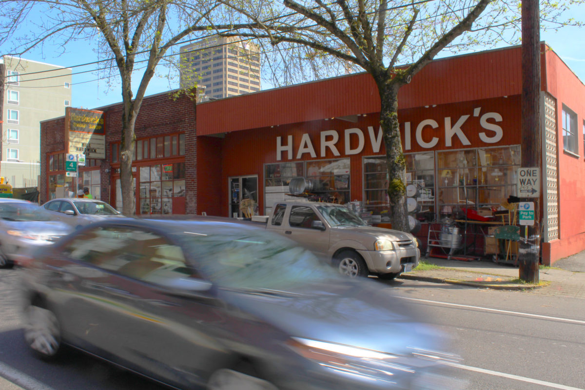 Buildings like the one that looms behind the store will eventually eradicate neighborhood businesses that have been a part of Seattle's University District for many decades.