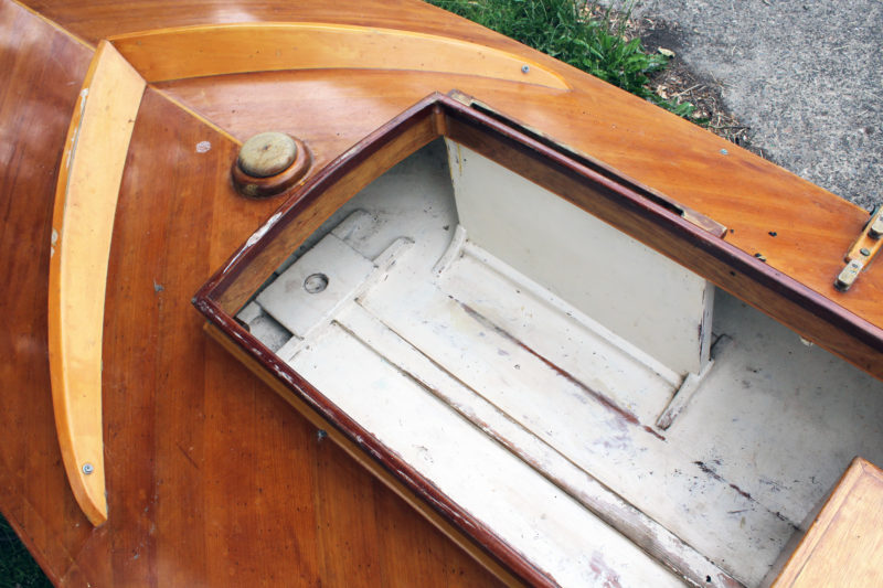 I built my cold-molded sneak box with the offset daggerboard case Chapelle documented. I slept with my feet tucked under the foredeck. I occasionally put the hatch over the cockpit opening for warmth or to keep the rain out. the boat was only 14" deep, so with the lid on I could understand why the sneakbox was known to some as "the devil's coffin." 