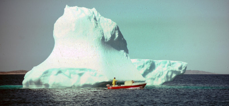 When you catch a big fish, you take a photo. When you pass a grounded iceberg, you do the same. The notorious Iceberg Alley passes down the Labrador coast just a few miles offshore; ’bergs often drift from the current and go aground on Labrador shallows. Geof and TORNGAT check one out.