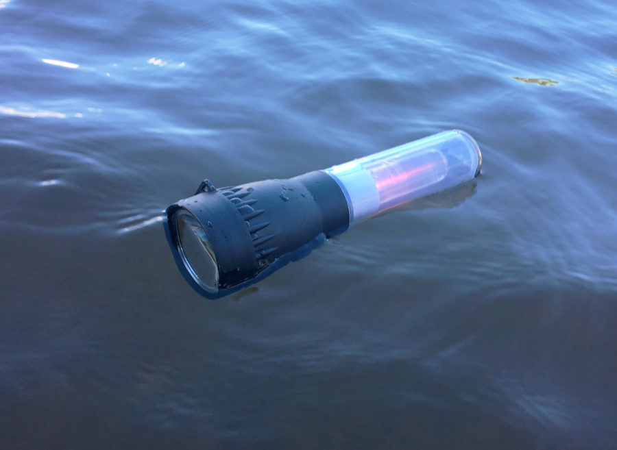 If the flashlight gets dropped overboard it will float and automatically start flashing the red light in its handle.