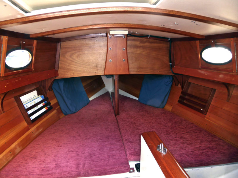 The Winter Wren's cabin acreage is mostly given to the V-berth, which is punctuated with the mast compression post, a 1" steel tube dressed up with a mahogany sheath. The daggerboard case, slightly offset to starboard, bisects the rest of the available space.