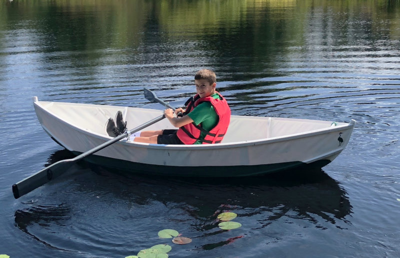 The boat's bow bears the heron from the school's logo. The pond is a good habitat for herons, so the school chose it as its symbol when the school was founded in 1956. This version is now "old school," as the logo was updated this summer.