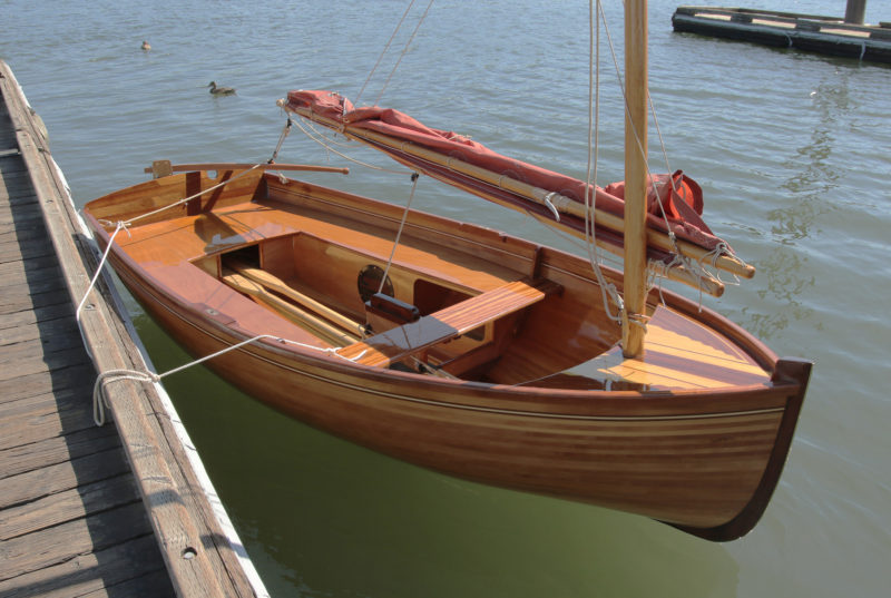 The stern-sheets center panel is removable to allow the oars to be tucked under the center thwart and stored in the bottom of the boat. Magnets hold the panel in place.
