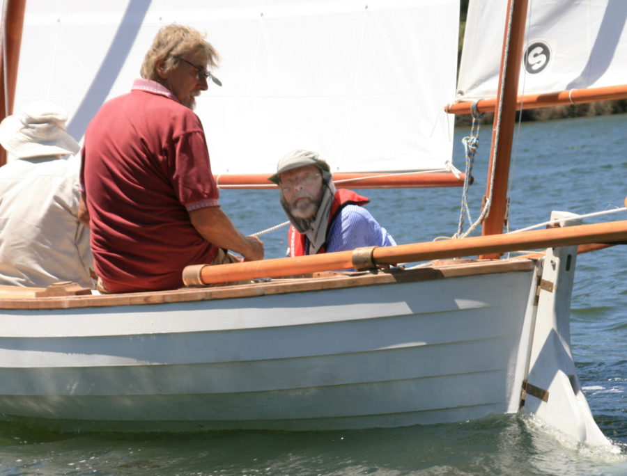 With JIM crewed by his friends, Peter takes JIM's helm for her first sail.