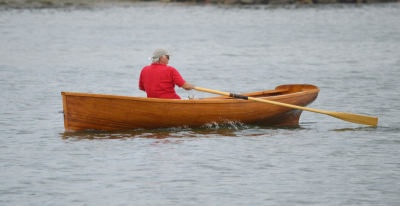 The Whitehall's long straight keel is about 3" deep and assures straight tracking. At speed here, teh Whitehall is showing very little wake at the bow, an indication of the boat's fine entry.