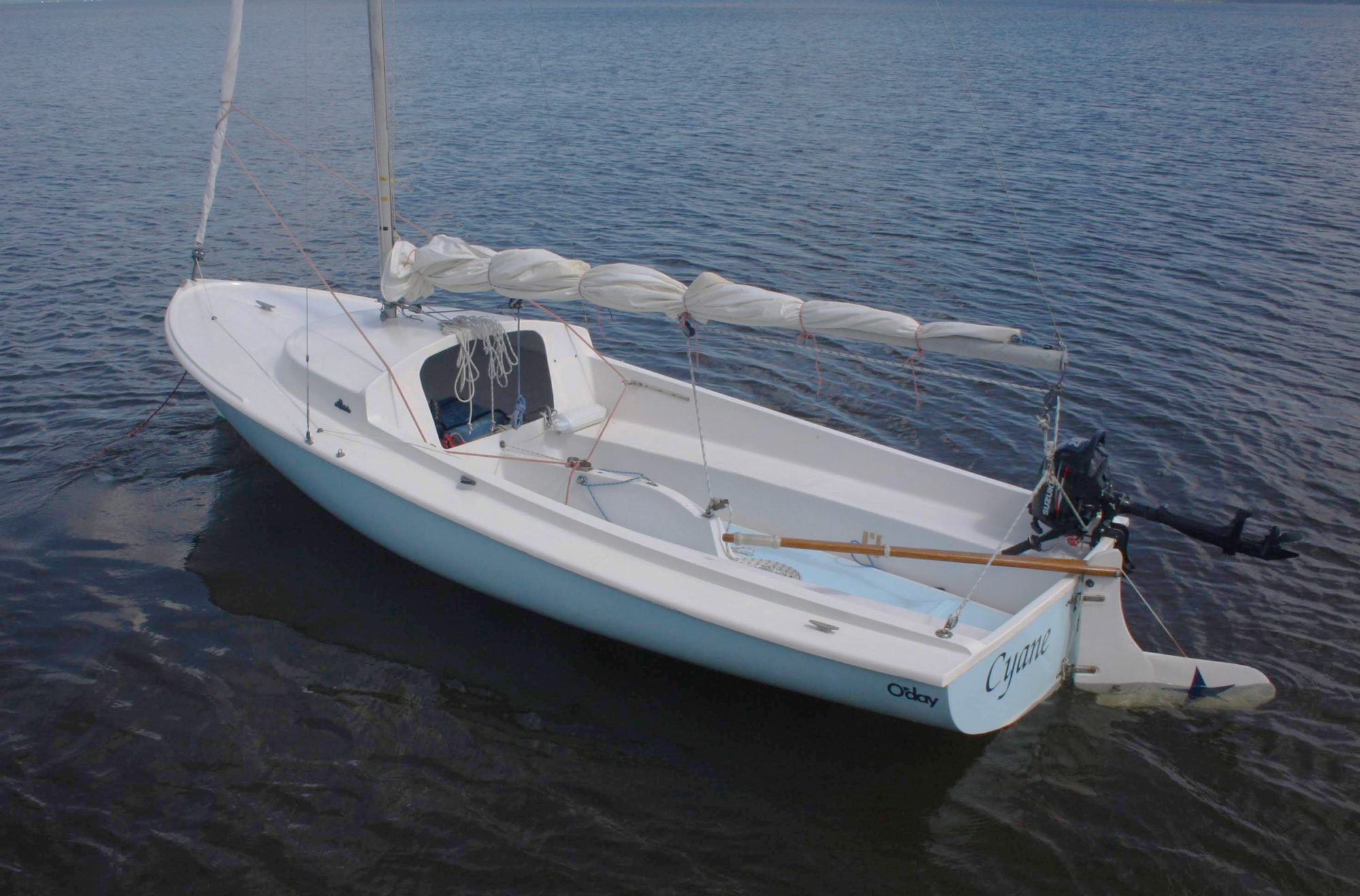 small sailboat with outboard motor