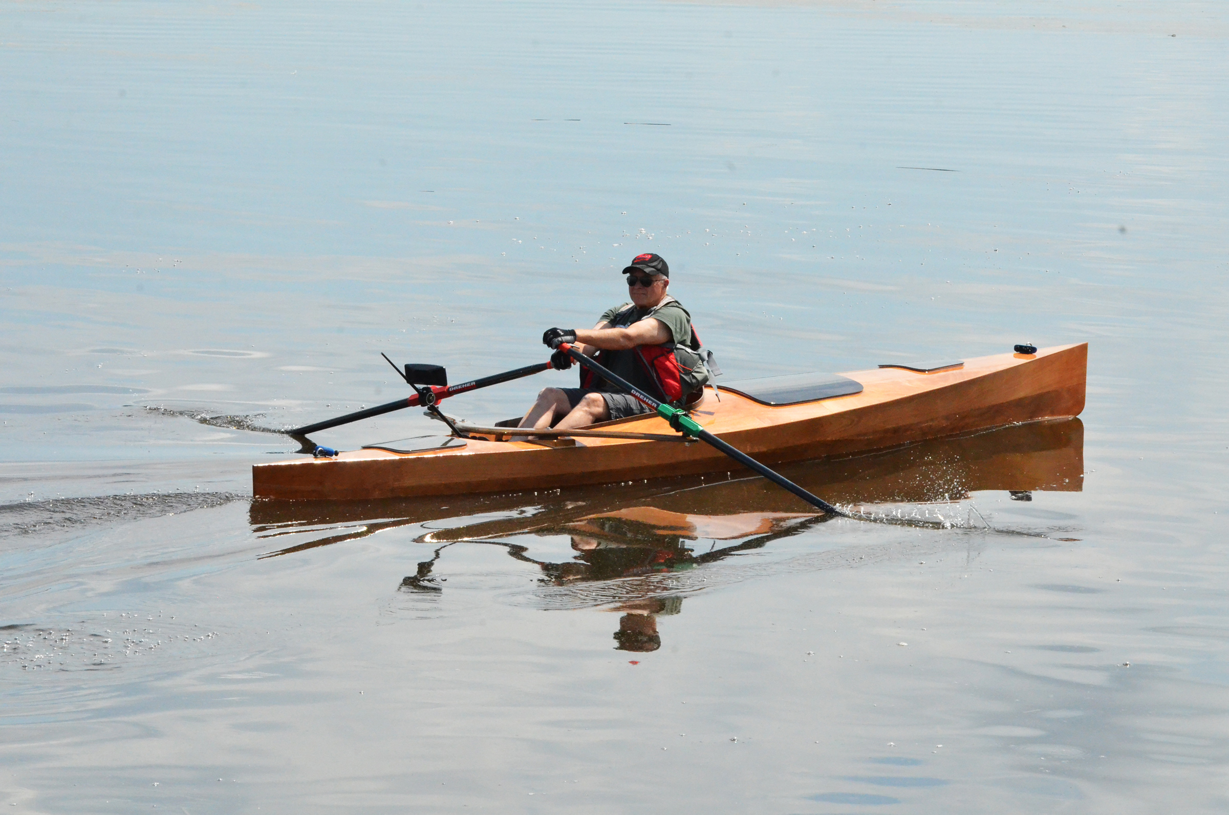 Jim Duff rows past the camera in an Expedition rowboat from Angus