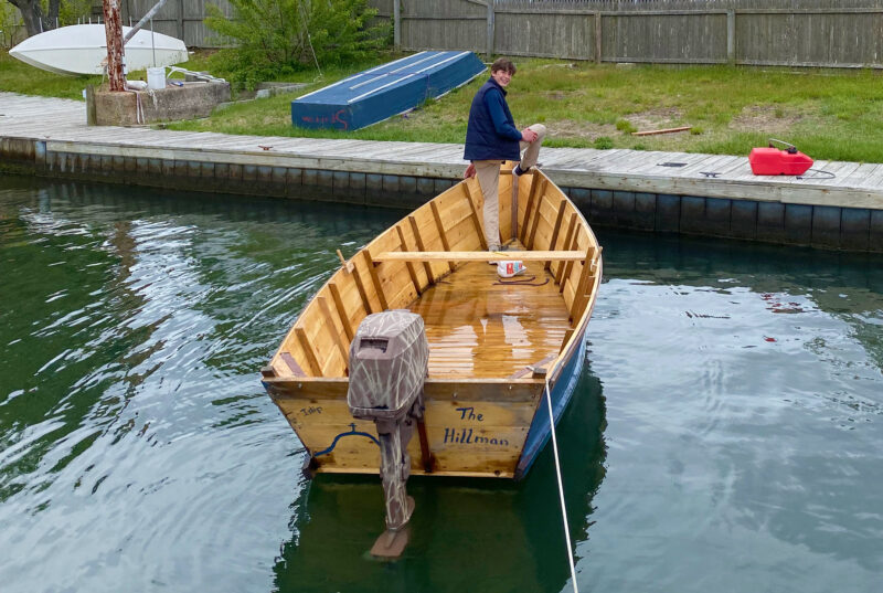 A sailor stands aboard a United Nations Flat-Bottomed Skiff.