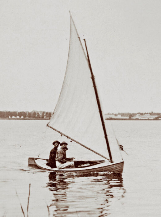 Black and white photo of two sailors aboard a Delaware Ducker.