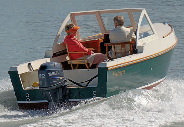 Rearview of Bay Pilot 18 powerboat with Yamaha motor.