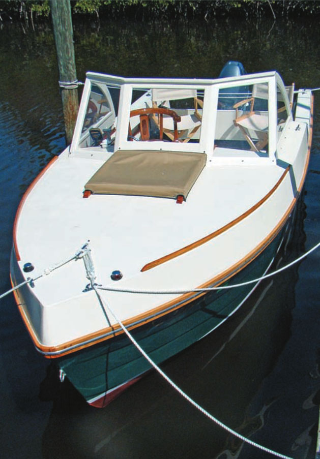 White powerboat with open cockpit.