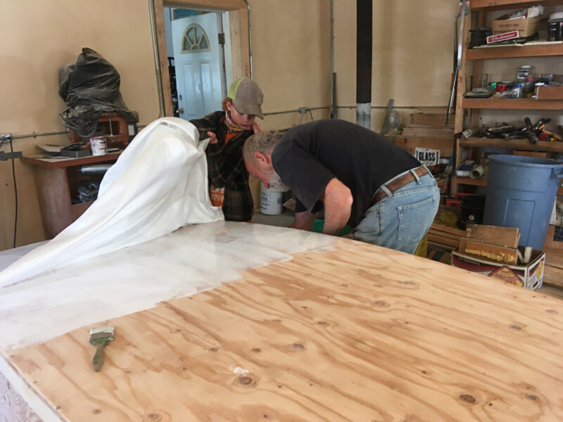 Laying fiberglass on Mayfly 14 bottom