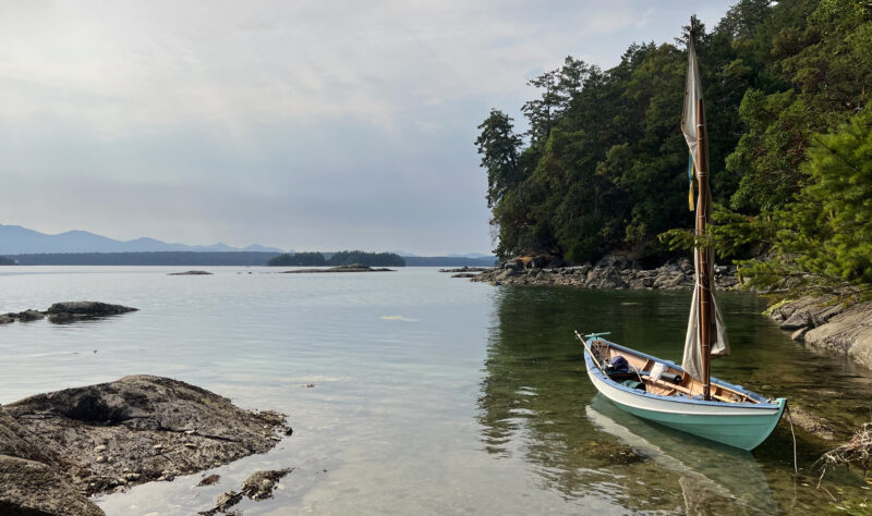 Swampscott Dory moored in peaceful cove on Wallace Island
