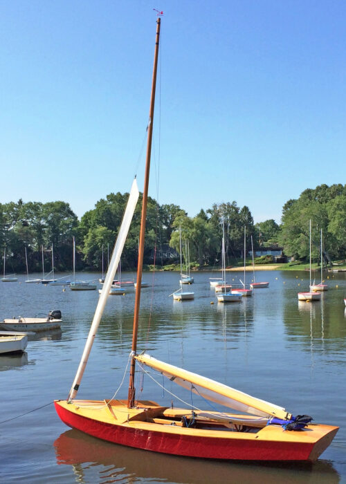 Snipe sailing dinghy on mooring