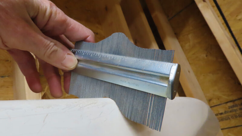 Using a contour gauge to record the kayak's keel profile