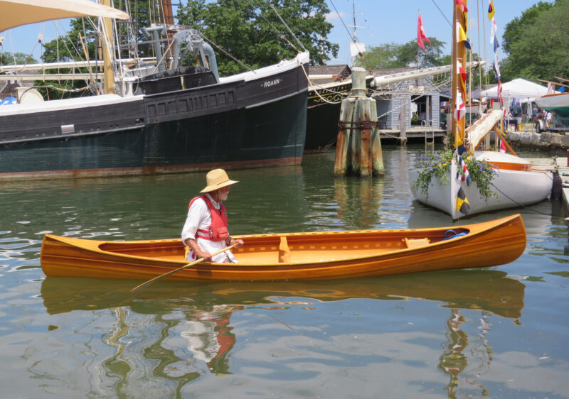 Single paddler in 16' strip-planked canoe